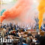 Smoke bombs ignited as Hungarian parliament passes law banning Pride events